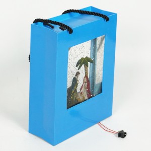 Hot sell plastic hand gift bag design nativity sence Christmas musical Led water spinning glitter snow globe